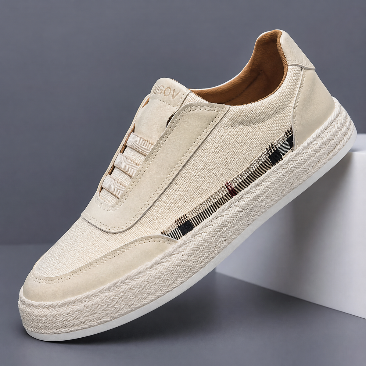 Detail view of the laces and linen upper on the sneakers