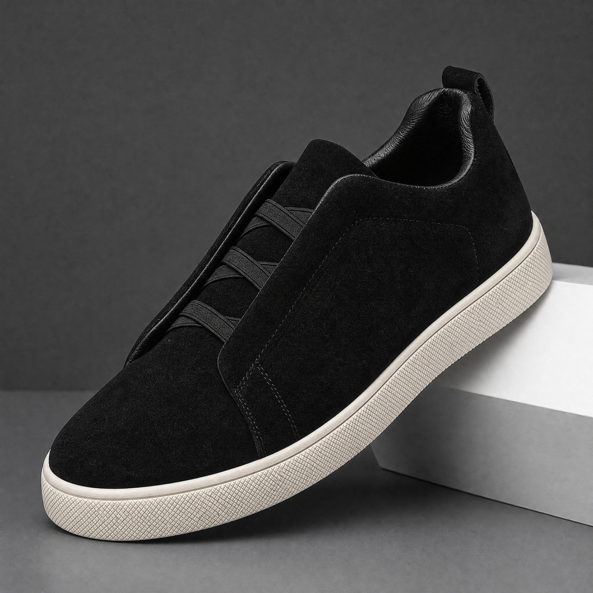 Men's suede sneakers shown together from an angled view