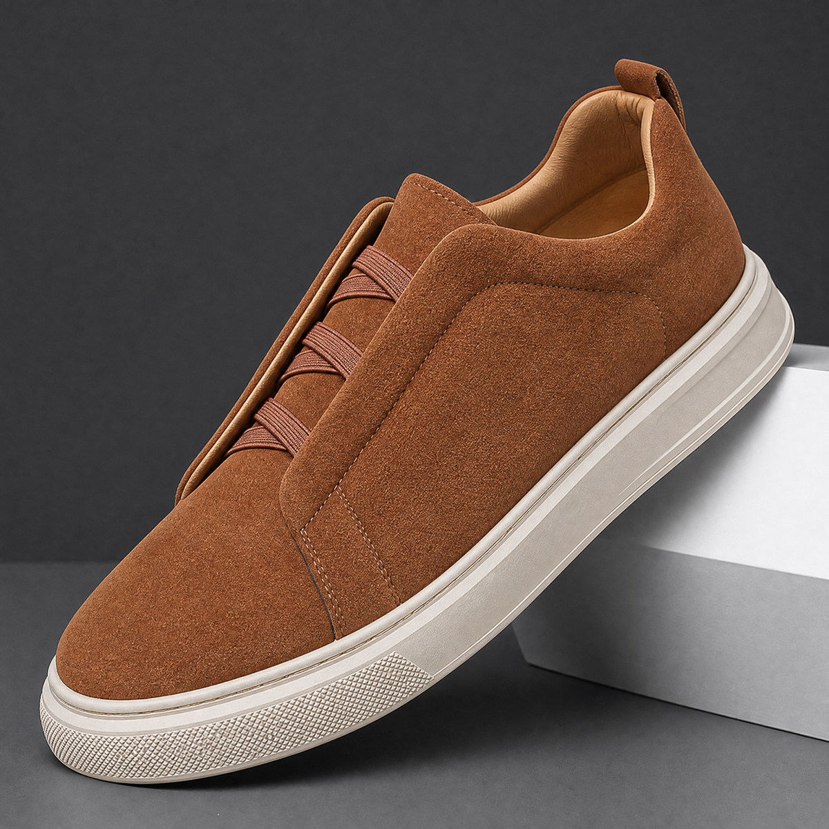 Men's suede sneakers with stretch laces shown from the side