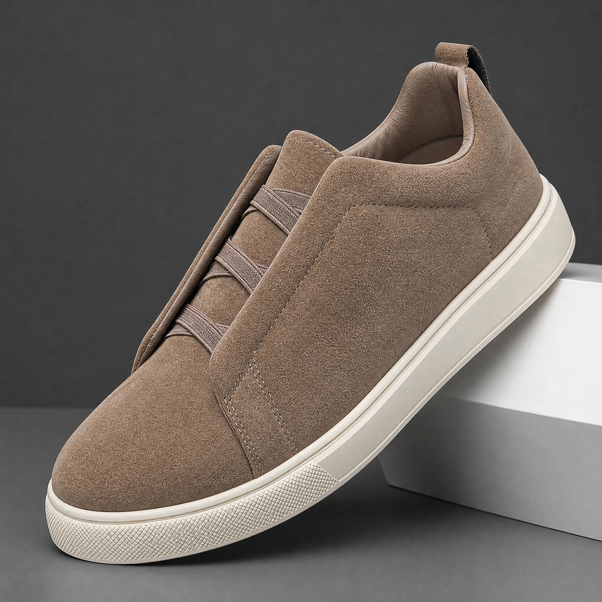 Close-up of the suede upper and stretch laces on men's sneakers