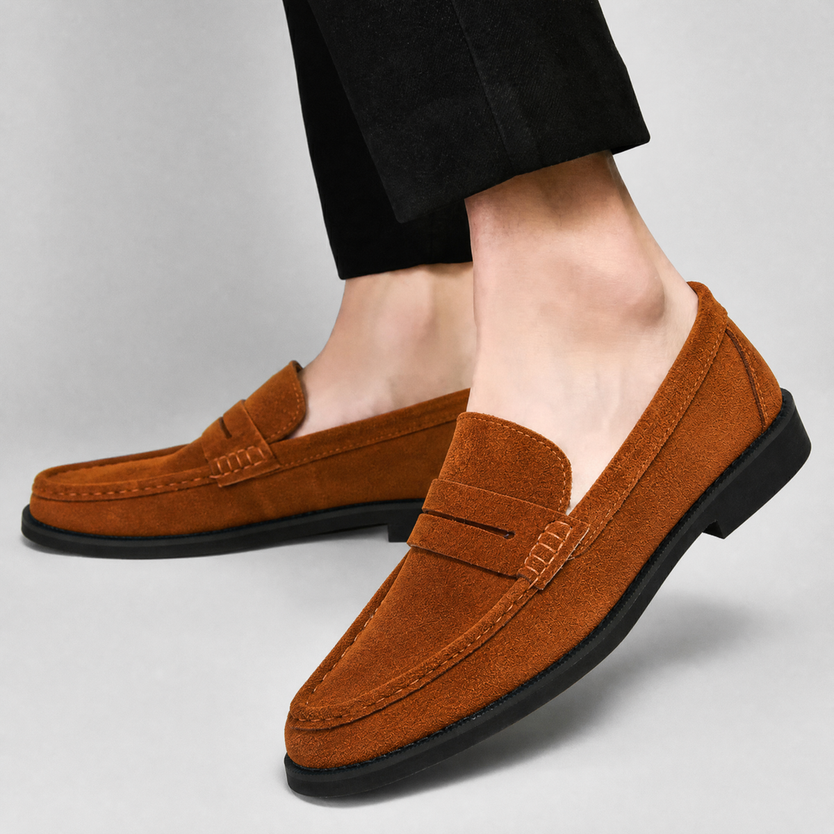 Close-up of the suede upper on a men's penny loafer