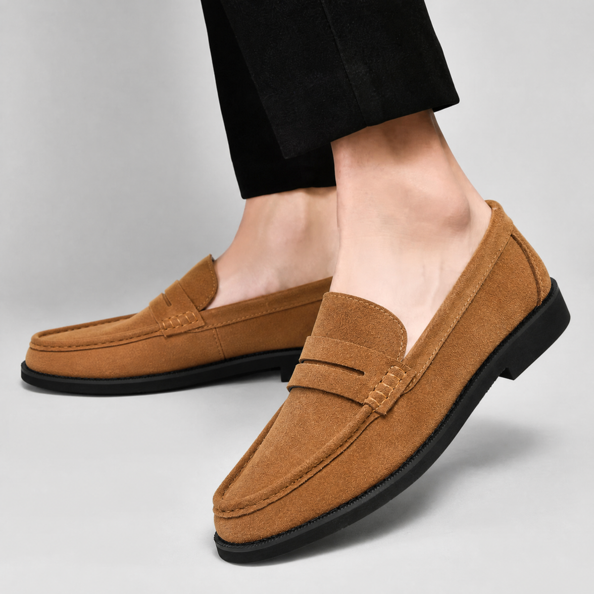 Angled view of men's suede penny loafers