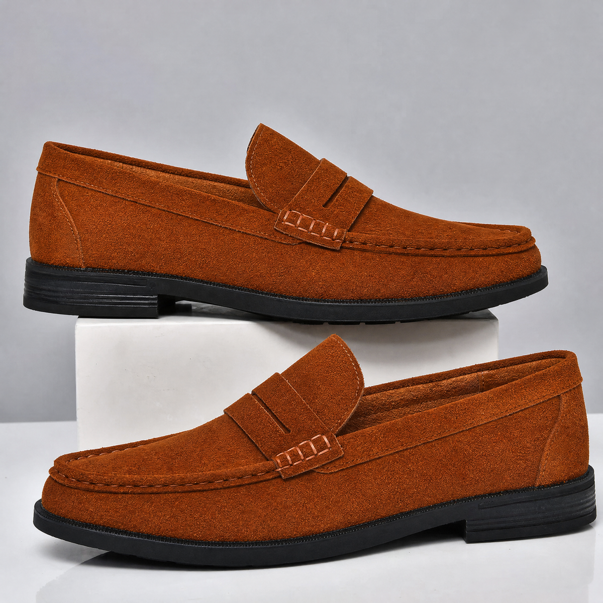 Men's suede penny loafer with classic penny strap detail