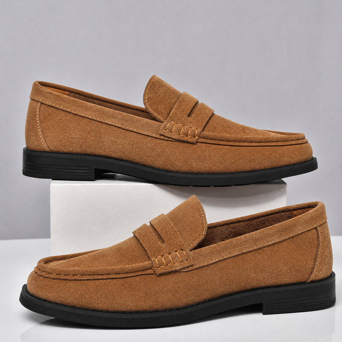 Front view of classic men's suede penny loafers