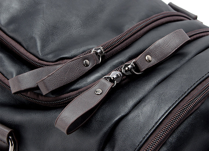 Side view of the men's leather duffel bag highlighting its structured shape and leather finish