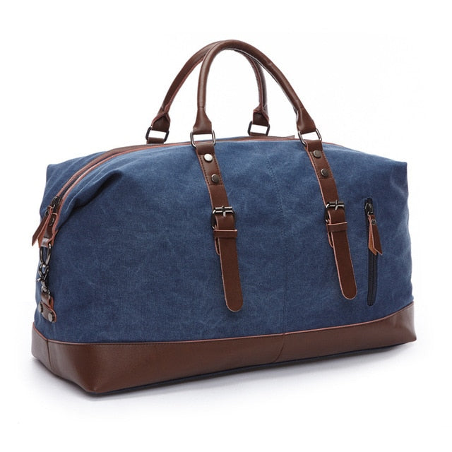 Vintage leather and canvas duffle bag shown from the front with handles and shoulder strap